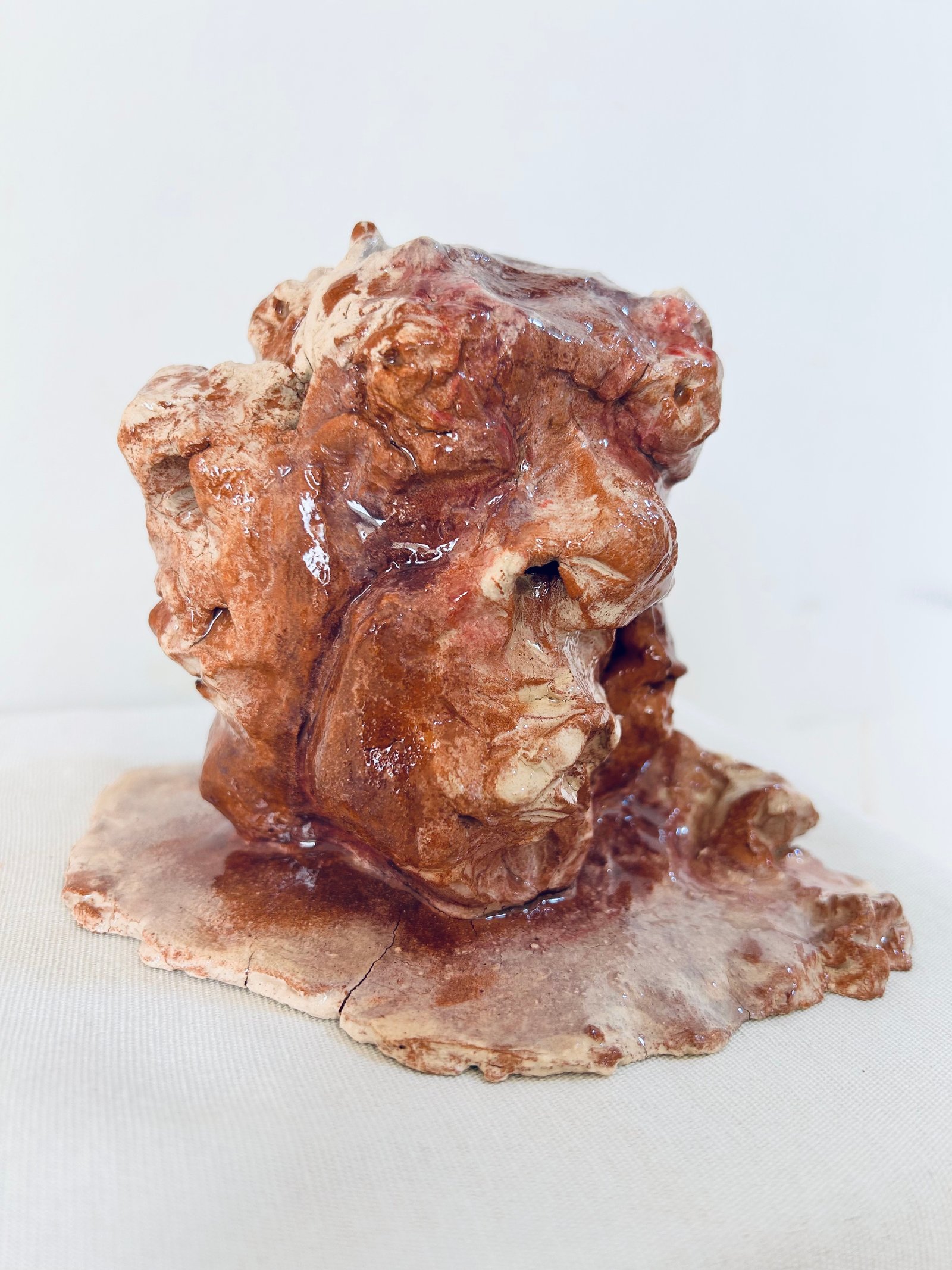 Multiple terrified faces emerging from a single head - Main View